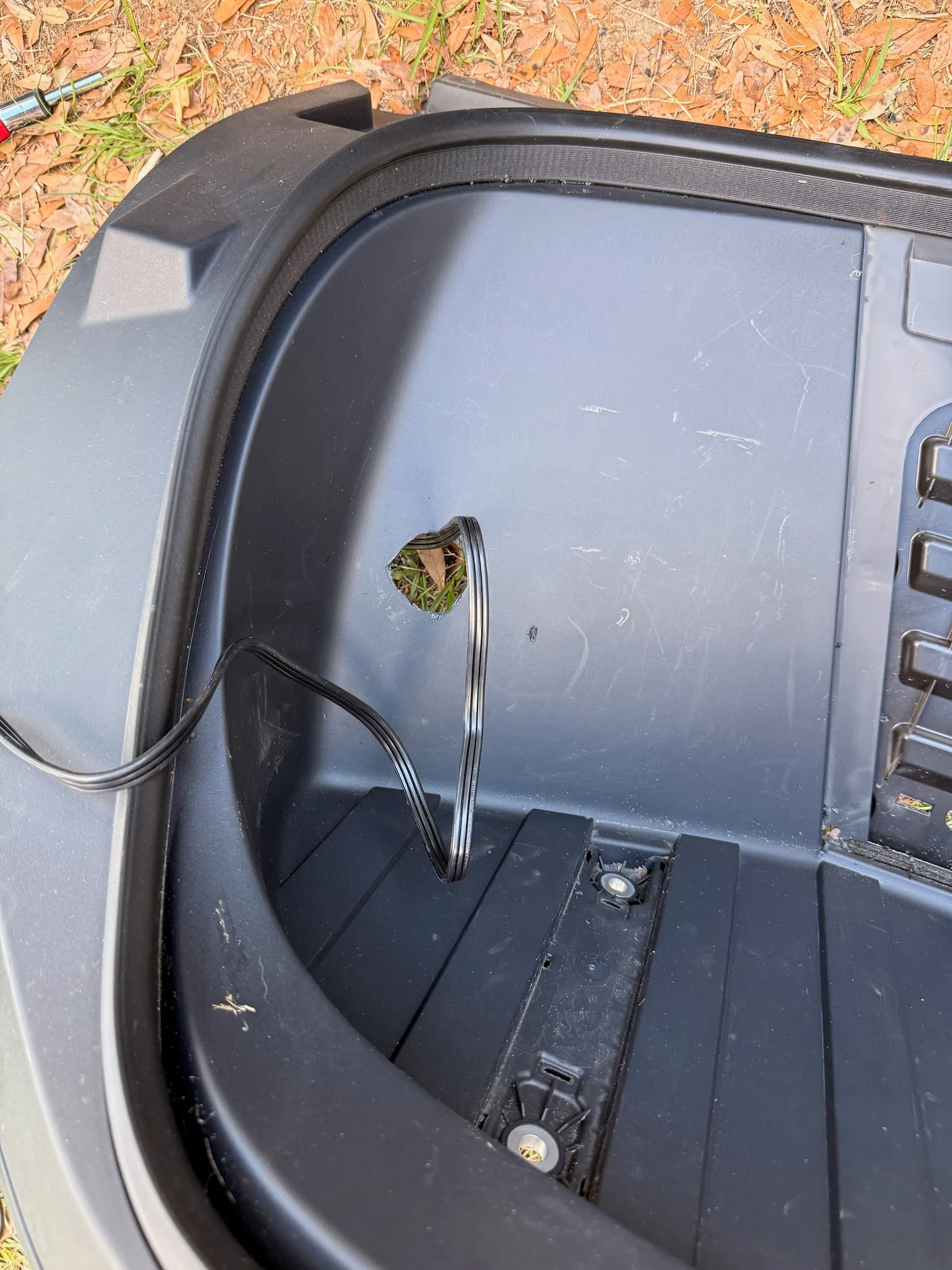 Cutout in the Cybertruck frunk trim for the 120V outlet